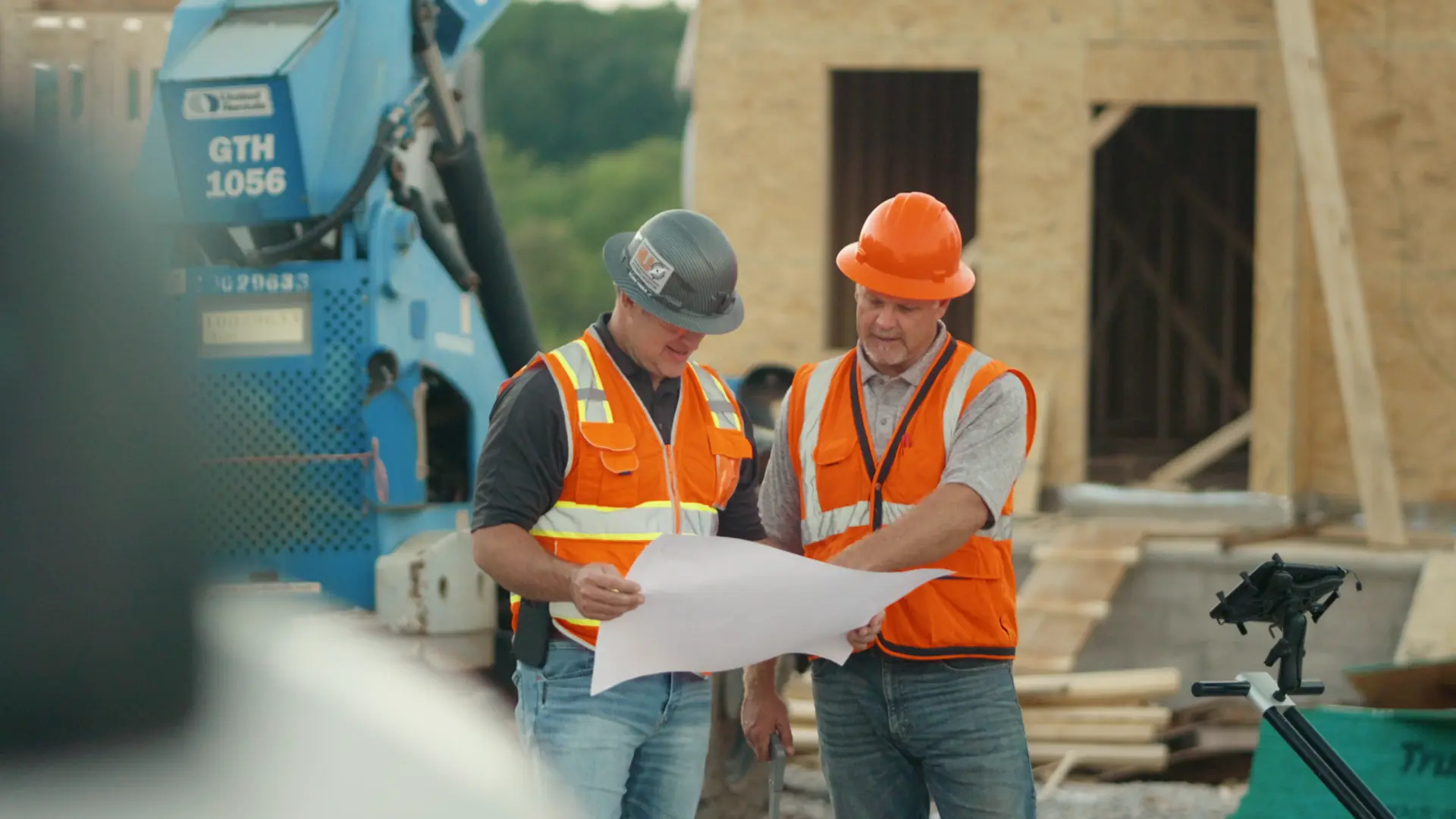 Utility Locators technicians reviewing job site plans before starting utility locating work